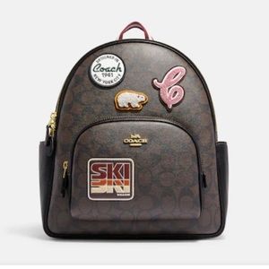 NET coach Court Backpack In Signature Canvas
With Ski Patches